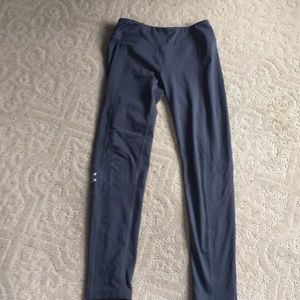 Dark gray girls lightly warn under armor leggings.